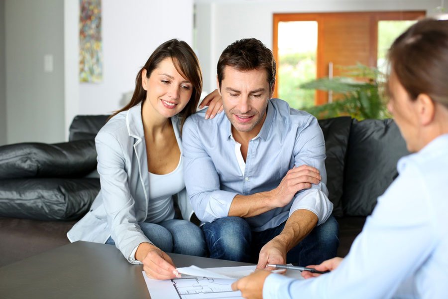 couple meeting with mortgage broker