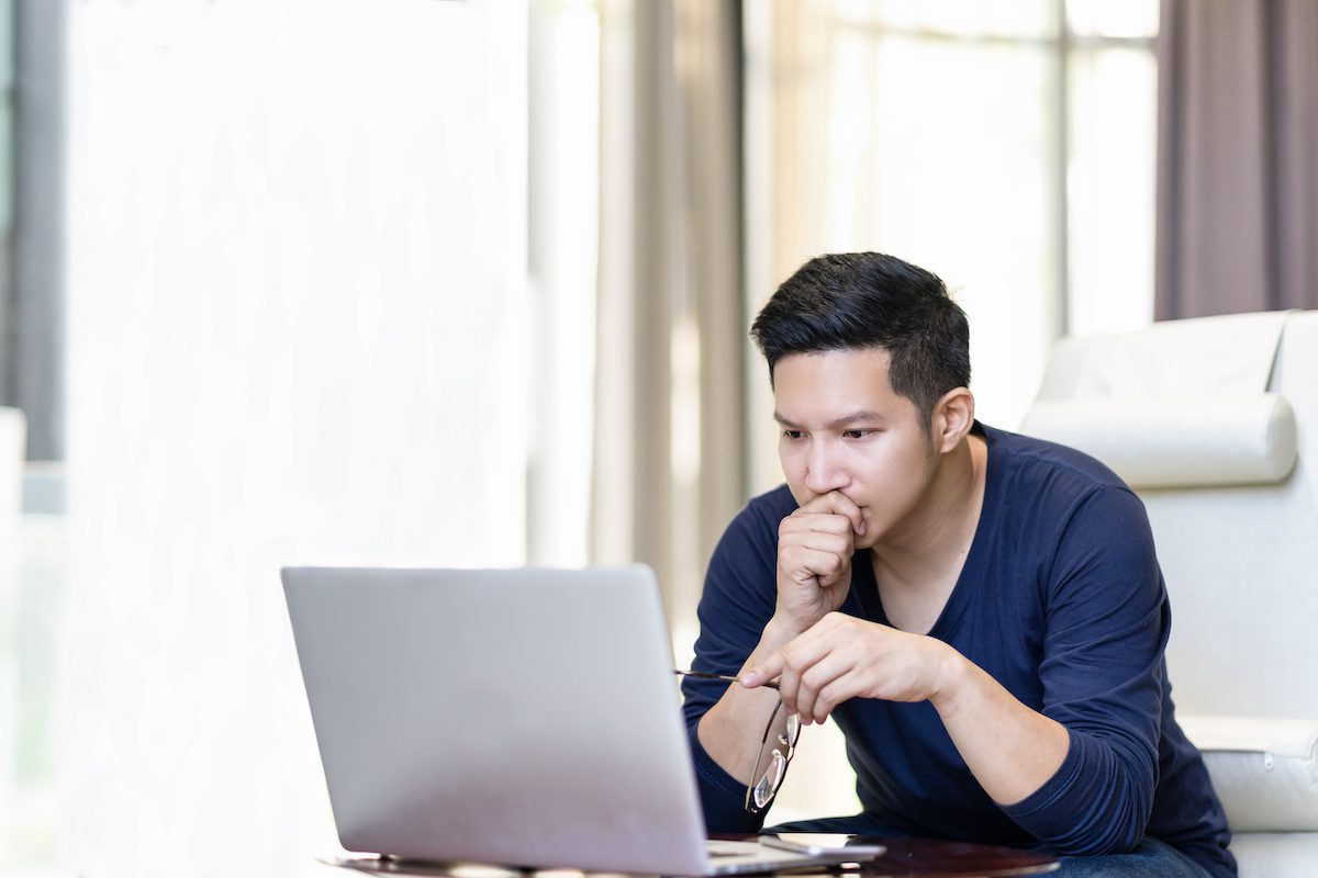 Man looking intently at his computer